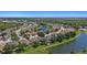 A scenic aerial view captures the serene community and tranquil pond, creating a picturesque backdrop for a peaceful neighborhood at 5194 Layton Dr, Venice, FL 34293