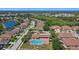 A beautiful aerial view showcases the community pool, clubhouse, and surrounding neighborhood, perfect for relaxed living at 5194 Layton Dr, Venice, FL 34293
