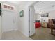 Bright bedroom visible from hallway with white door at 5194 Layton Dr, Venice, FL 34293