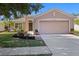 Charming single-Gathering home boasts a manicured lawn and a two-car garage for added convenience at 5194 Layton Dr, Venice, FL 34293
