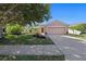 Charming single-story home with a well-manicured lawn, mature trees, and a two-car garage in a desirable neighborhood at 5194 Layton Dr, Venice, FL 34293