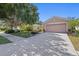 Charming single-story home with a well-manicured lawn, mature trees, and a two-car garage in a desirable neighborhood at 5194 Layton Dr, Venice, FL 34293