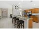 Open kitchen featuring granite countertops, stainless steel appliances and a breakfast bar with seating at 5194 Layton Dr, Venice, FL 34293