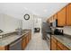 Spacious kitchen with stainless steel appliances, granite counters, and modern cabinetry at 5194 Layton Dr, Venice, FL 34293