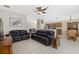 Spacious living room offers open layout with views of the kitchen and dining areas at 5194 Layton Dr, Venice, FL 34293