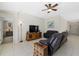 Inviting living room featuring a mounted television, comfortable seating and tile flooring at 5194 Layton Dr, Venice, FL 34293