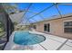 Relax in this refreshing screened-in pool and patio area, ideal for outdoor entertaining and leisure at 5194 Layton Dr, Venice, FL 34293