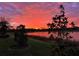 Spectacular sunset view over the lake, showcasing the community's natural beauty at 5505 Cantucci St, Nokomis, FL 34275