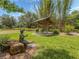 Beautiful park area featuring a covered seating area and a bronze statue on a sunny day at 5800 Niblick Pl, North Port, FL 34287