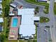 An aerial view shows the clubhouse, pool and amenities offered at this resident owned 55+ community at 6665 Keystone Ct, North Port, FL 34287
