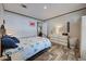 Comfortable bedroom with wood-look floors, a queen bed, a dresser, and a nautical-themed comforter at 6665 Keystone Ct, North Port, FL 34287