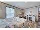 Comfortable bedroom with a metal bedframe, neutral colored walls, and wood-look flooring at 6665 Keystone Ct, North Port, FL 34287