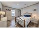 Comfortable bedroom with decorative metal bedframe, soft bedding, and lots of natural light at 6665 Keystone Ct, North Port, FL 34287