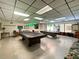 Well-lit billiard room with pool tables, offering a recreational space for residents at 6665 Keystone Ct, North Port, FL 34287
