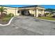 Clubhouse entrance with circular driveway at 6665 Keystone Ct, North Port, FL 34287