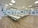 Massive community space featuring tables, chairs and a stage is ready for entertainment at 6665 Keystone Ct, North Port, FL 34287