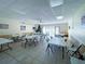 Spacious clubhouse is ready for celebrations of any kind with tables, chairs and holiday decorations at 6665 Keystone Ct, North Port, FL 34287