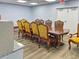 Formal dining room provides a stately dining experience with detailed wooden chairs at 6665 Keystone Ct, North Port, FL 34287
