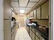Efficient kitchen design with ample cabinet space and essential appliances for meal preparation at 6665 Keystone Ct, North Port, FL 34287