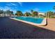 Bright pool featuring a brick surround and palm trees for shade is a great place to relax and unwind at 6665 Keystone Ct, North Port, FL 34287