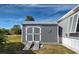 Outdoor shed with ramps, gray siding, double doors, and a metal roof; great for storage! at 6665 Keystone Ct, North Port, FL 34287
