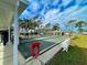 Well-maintained shuffleboard courts with players enjoying a game, showcasing community engagement at 6665 Keystone Ct, North Port, FL 34287