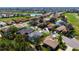 Aerial view of the home featuring pool and the surrounding neighborhood at 707 Petrel Way, Venice, FL 34285