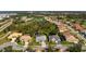 Aerial view of home showing roof, lawn, and neighborhood at 707 Petrel Way, Venice, FL 34285