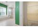 Bathroom with a walk-in shower, a soaking tub, and a walk-in closet at 707 Petrel Way, Venice, FL 34285