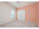 Bedroom with carpet, double closet, a window, and a ceiling fan at 707 Petrel Way, Venice, FL 34285