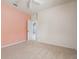 Bedroom with carpet and view of open doorway to another room at 707 Petrel Way, Venice, FL 34285
