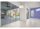 Open living space with sliding glass doors and tile flooring offers natural light with access to the outdoor pool at 707 Petrel Way, Venice, FL 34285