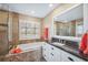 Elegant bathroom featuring a large soaking tub, granite counters, updated vanity and a glass enclosed shower at 803 Carnoustie Dr, Venice, FL 34293