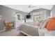 This primary bedroom features a king bed, slider to the patio, ceiling fan and a large closet at 803 Carnoustie Dr, Venice, FL 34293