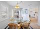 Charming breakfast nook featuring a glass table, wicker chairs, and plenty of natural light at 803 Carnoustie Dr, Venice, FL 34293