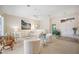 Bright, spacious living room with neutral tones, comfortable seating, and ample natural light at 803 Carnoustie Dr, Venice, FL 34293