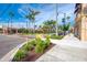 Picturesque street view showcasing colorful storefronts, palm trees, and vibrant landscaping in a bustling downtown area at 803 Carnoustie Dr, Venice, FL 34293