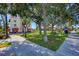 Charming town square featuring shaded benches, lush greenery, and historical buildings, creating a welcoming atmosphere at 803 Carnoustie Dr, Venice, FL 34293