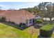 Aerial view of the home, showcasing the lush lawn and screened in porch at 805 Derbyshire Dr, Venice, FL 34285