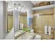 Updated bathroom features a glass shower, granite vanity, and modern lighting at 805 Derbyshire Dr, Venice, FL 34285