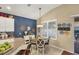 Inviting dining area with a round table, lovely decor, and natural light from the window at 805 Derbyshire Dr, Venice, FL 34285