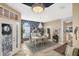 Dining room featuring a statement wall, white table set and tile floors at 805 Derbyshire Dr, Venice, FL 34285