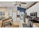 Well-lit kitchen with stainless steel appliances, granite countertops, and ample cabinet space at 805 Derbyshire Dr, Venice, FL 34285