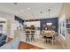 Open kitchen and dining area with modern appliances, granite countertops, and stylish decor at 805 Derbyshire Dr, Venice, FL 34285