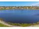 Stunning aerial view of a serene lake surrounded by charming homes at 805 Derbyshire Dr, Venice, FL 34285