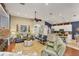 Open-concept living room with kitchen view featuring stylish decor and comfortable seating at 805 Derbyshire Dr, Venice, FL 34285