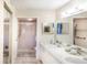 Clean bathroom featuring a double sink vanity, a walk-in shower, and modern fixtures, perfect for a spa-like experience at 811 Waterside Dr # 102, Venice, FL 34285