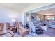 Comfortable living area featuring neutral tones, tile floors, and sliding glass doors to the lanai at 811 Waterside Dr # 102, Venice, FL 34285