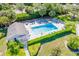 Aerial view of a sparkling pool, with well-maintained patio furniture at 811 Waterside Dr # 102, Venice, FL 34285