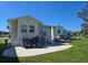 Nice exterior view with ample patio space and backyard on a sunny day at 88 Bainbridge Dr # 88, Nokomis, FL 34275